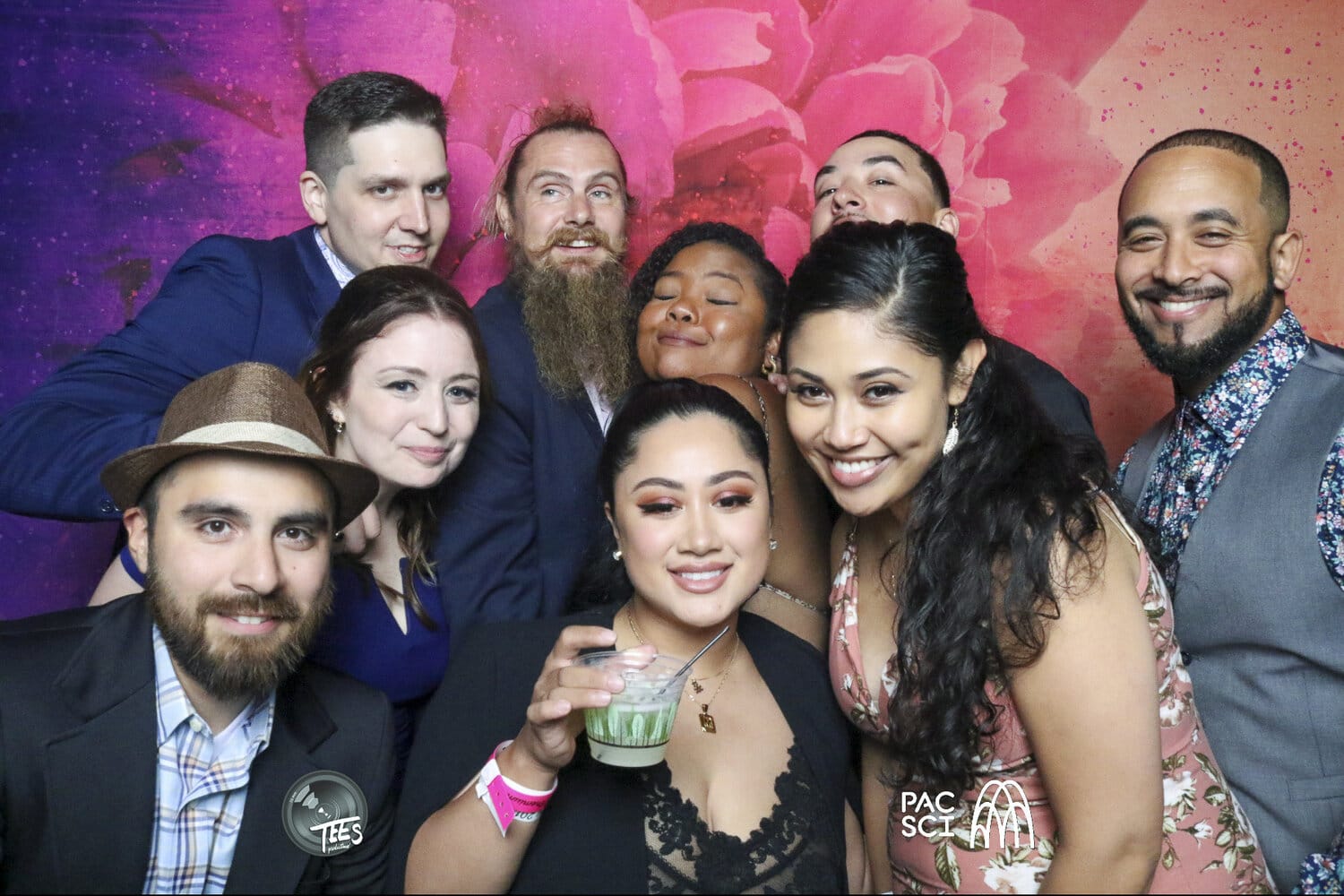 Group of friends in formal attire smiling together at Classic Photo Booth corporate event