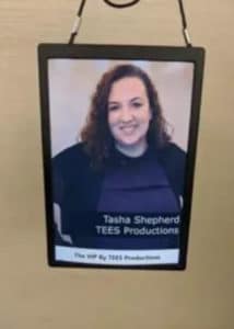 VIP Badge Booth lanyard photo print displayed against beige wall