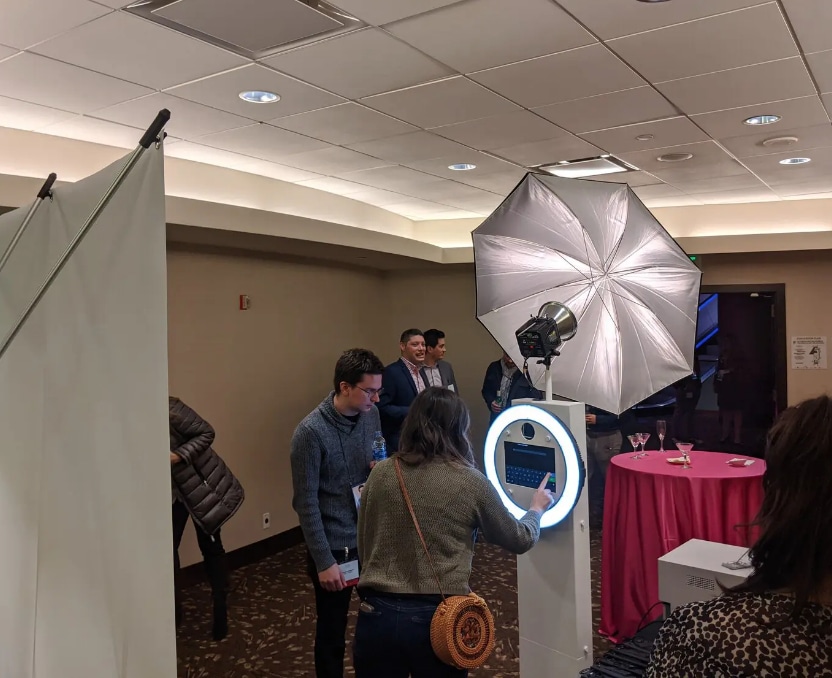 VIP Badge Booth station with ring light and host at corporate hotel event