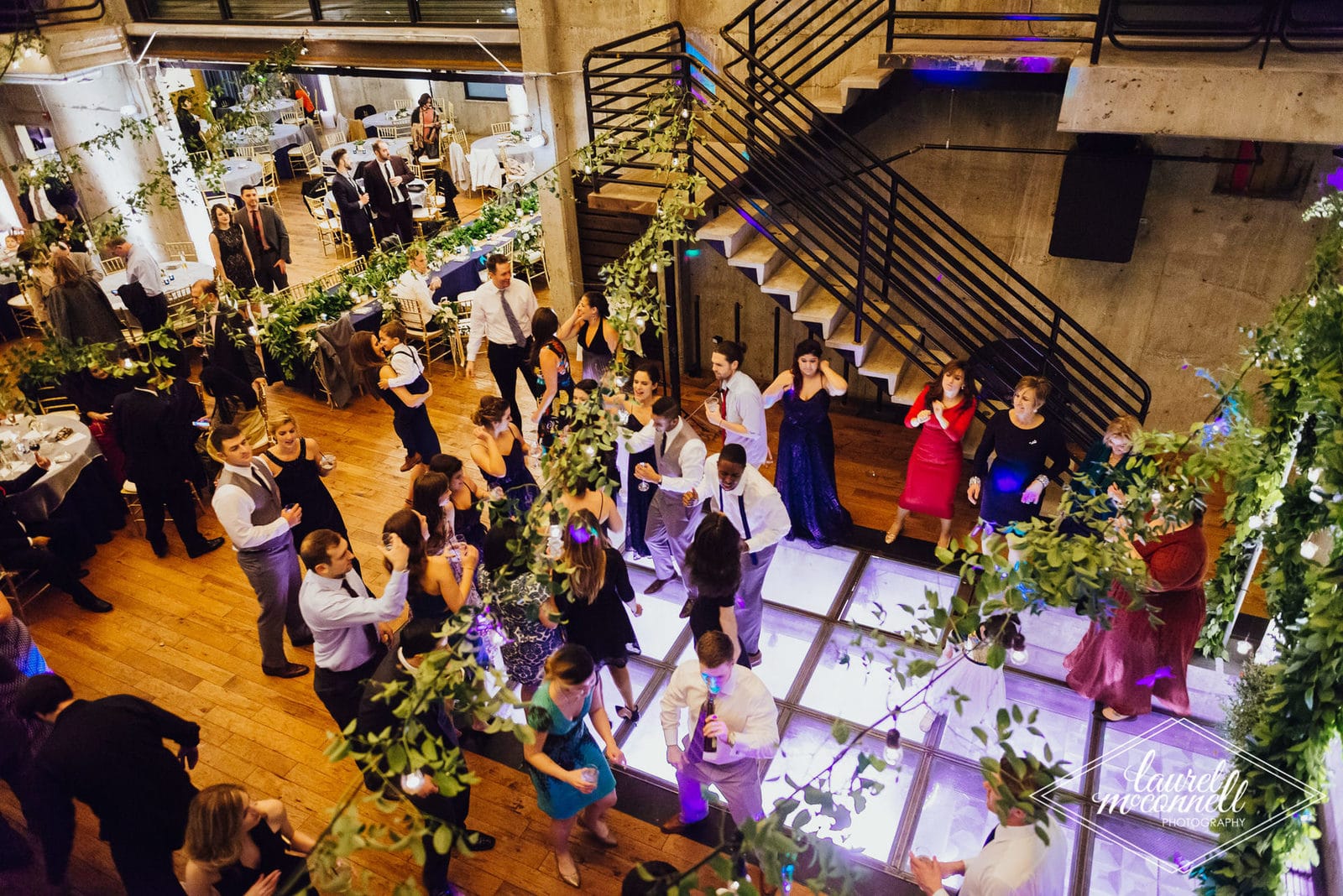 Fremont Foundry industrial wedding venue interior with greenery and string lights