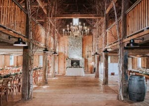 Allrose Farm rustic wood barn wedding venue interior with chandeliers