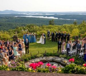 Castle in the Clouds outdoor wedding ceremony with mountain and lake views
