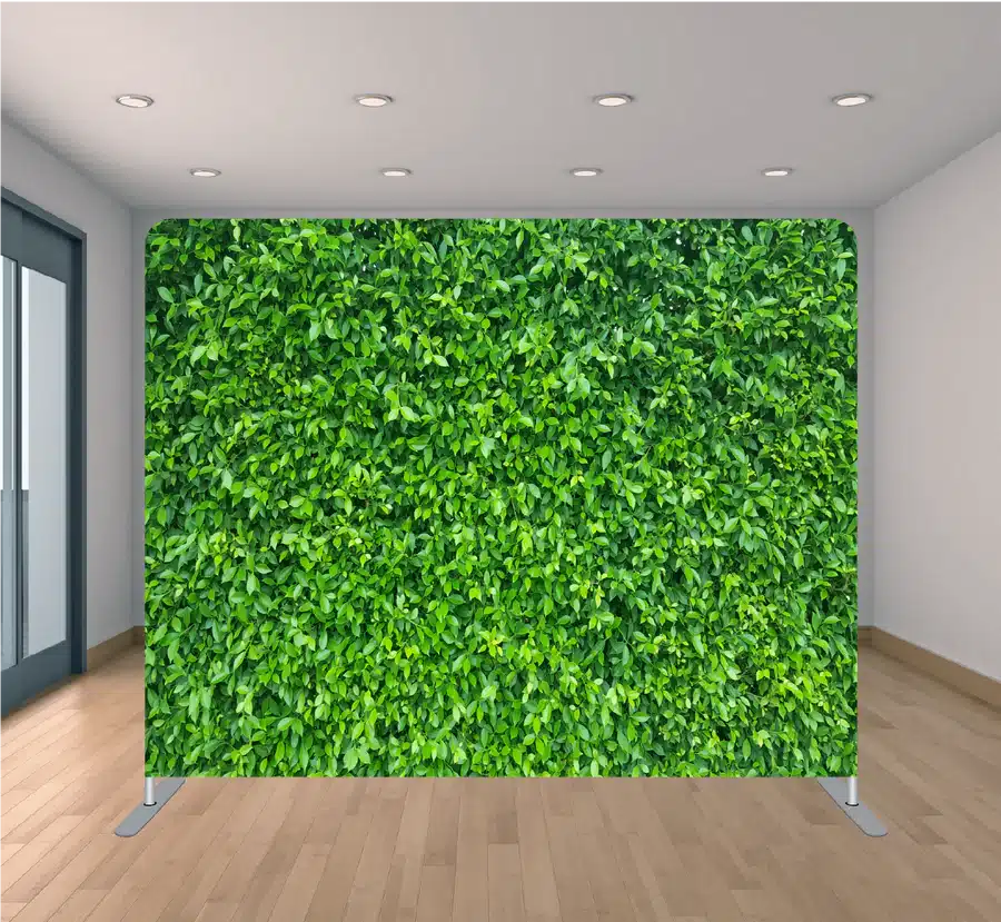 Green boxwood hedge wall photo booth backdrop