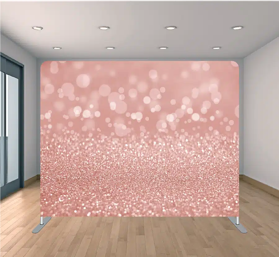Rose gold bokeh photo booth backdrop with soft glowing light circles